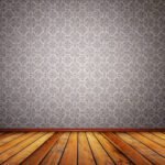 brown wooden floor and a gray wall